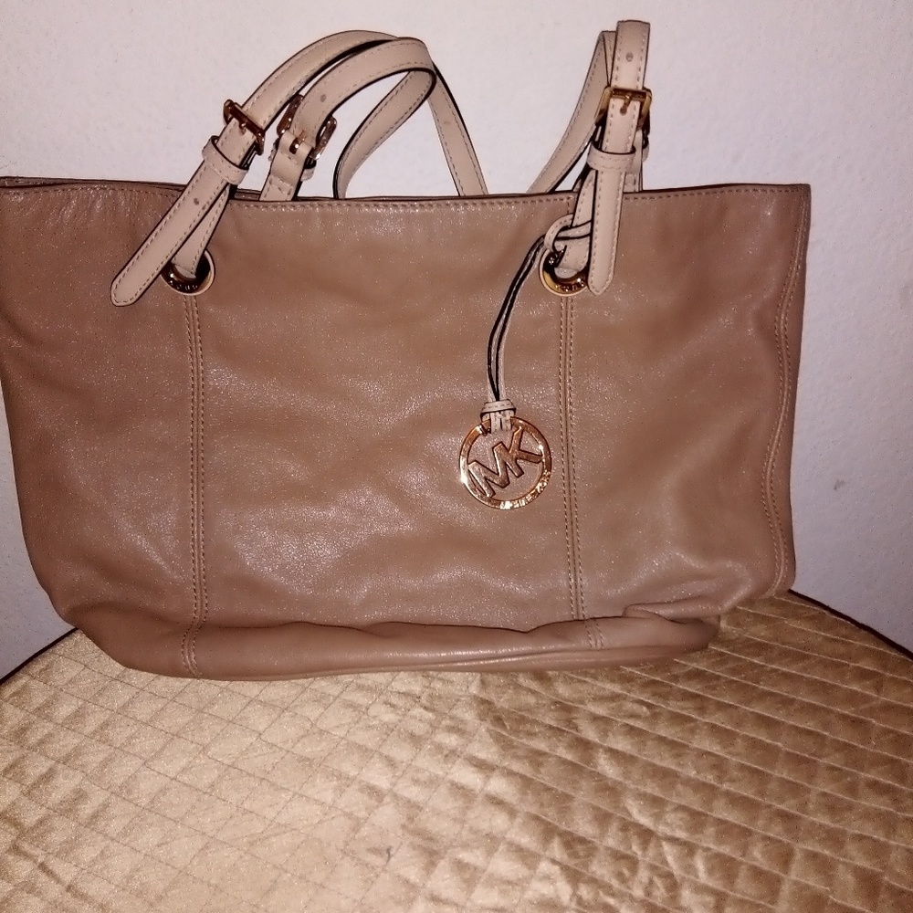 Tan Handbag with large pocket on the side